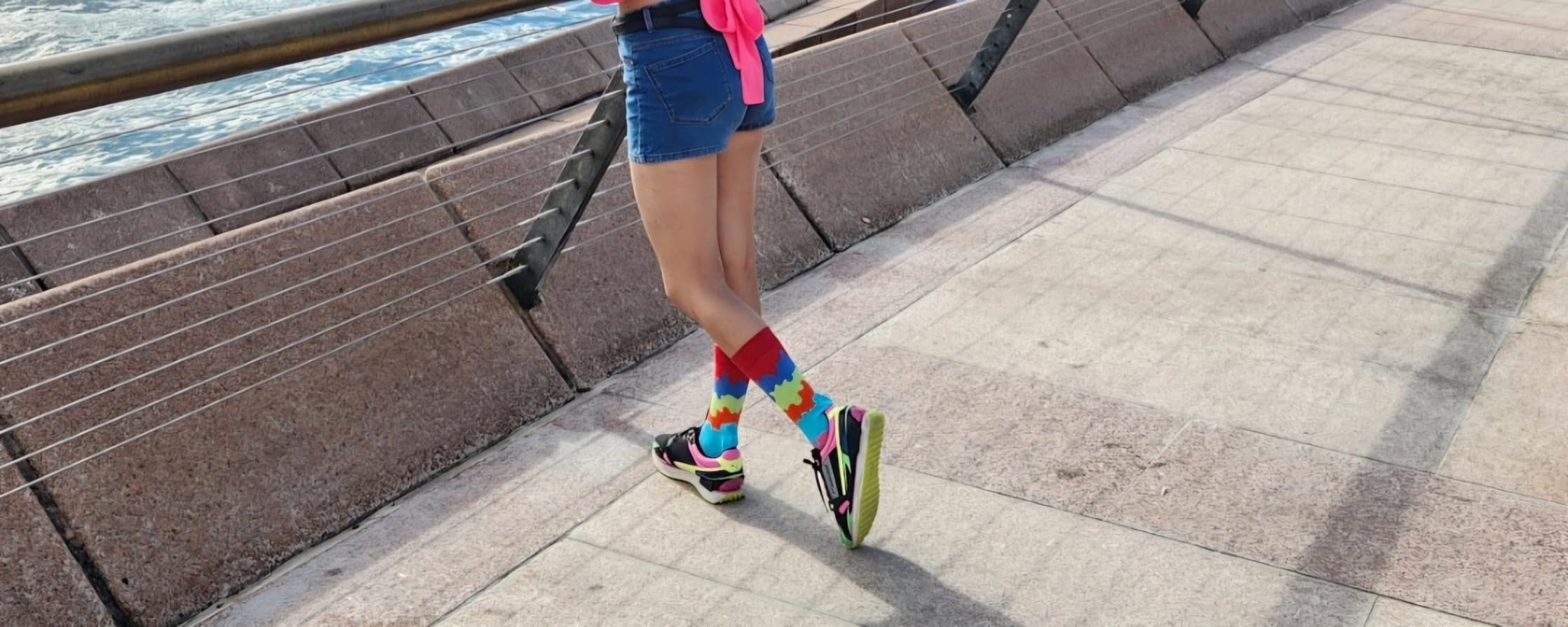 Customer wearing Jumplings colourful socks outdoors