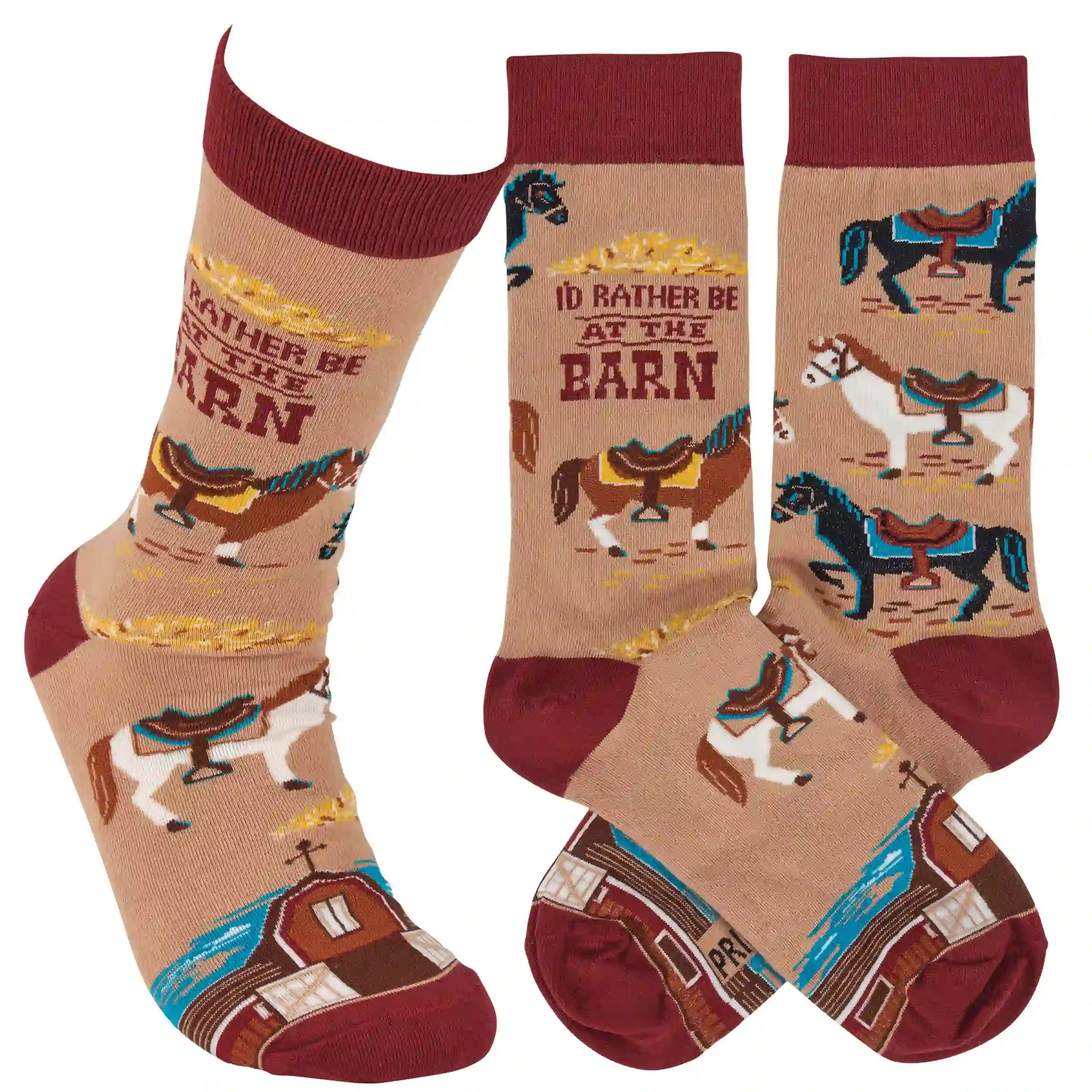 This pair of colorful socks displays a unique hand illustrated designs of various horses with saddles with a fun sentiment that reads "I'd Rather Be At The Barn." Socks feature a one size fits most design made with cotton, nylon, and spandex. A fun western-themed gift perfect for everyday self-expression.