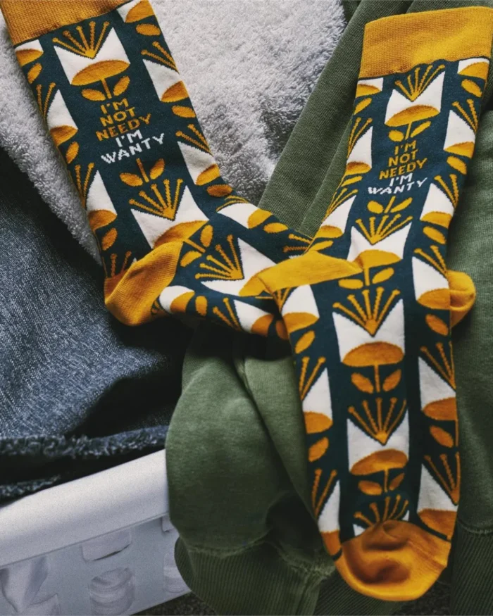 Treat your feet to a pair of "I'm Not Needy" socks! These quirky socks are not only comfortable, but also feature funny sayings that will keep you smiling. So forget being needy, embrace your "wanty" side with these playful socks.