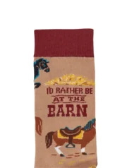 This pair of colorful socks displays a unique hand illustrated designs of various horses with saddles with a fun sentiment that reads "I'd Rather Be At The Barn." Socks feature a one size fits most design made with cotton, nylon, and spandex. A fun western-themed gift perfect for everyday self-expression.